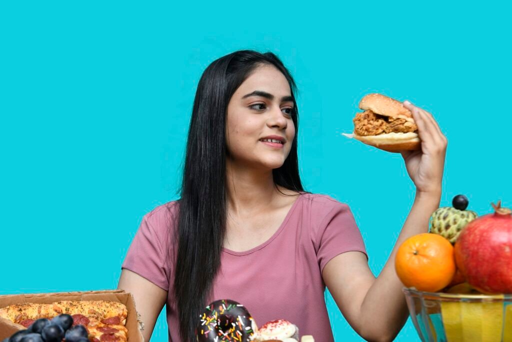 a woman holding a sandwich